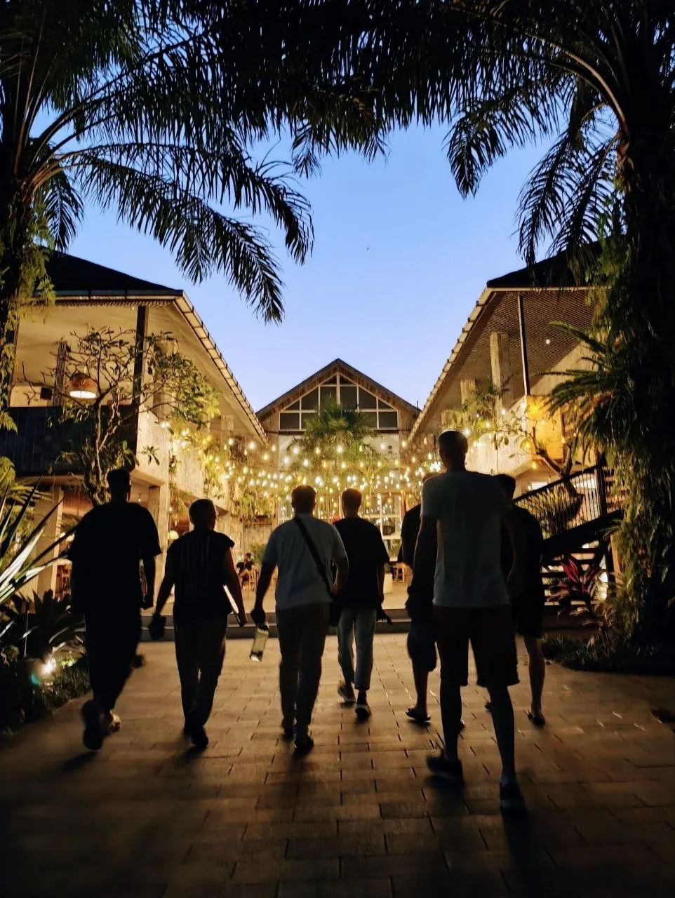 The team walking through the ONYX campus courtyard in the evening